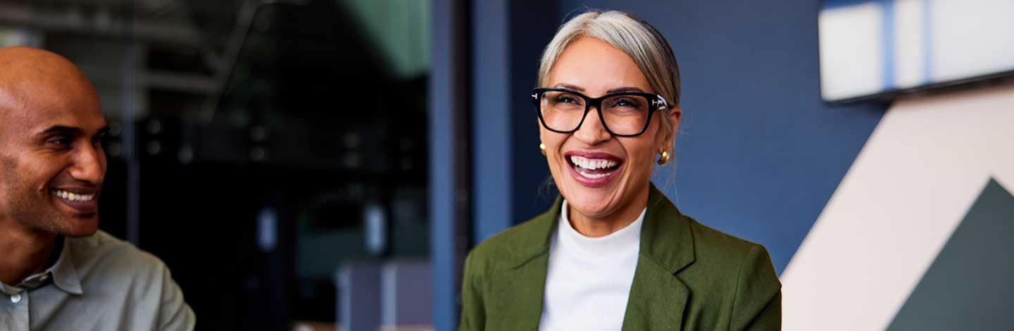 Worker smiling at colleagues